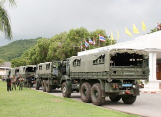 With dark skies as a backdrop, the navel convoy prepares to leave to assist flood-relief efforts in Ayutthaya.